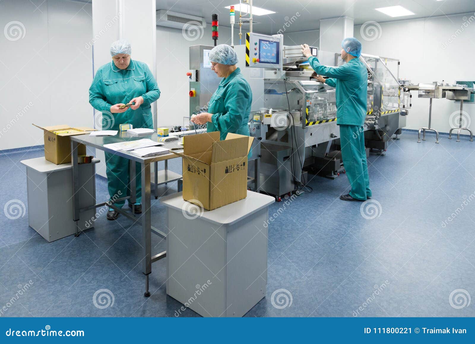 Pharmaceutical Factory Workers in Sterile Environment Stock Image