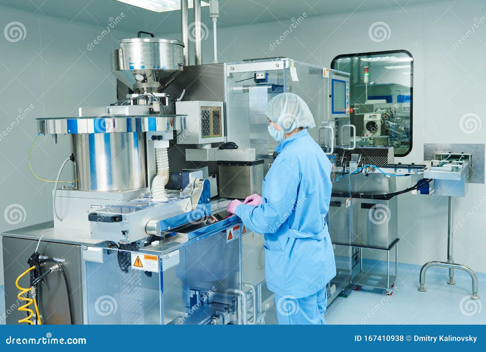 Pharmaceutics. Pharmaceutical Worker Operates Blister Packaging Machine