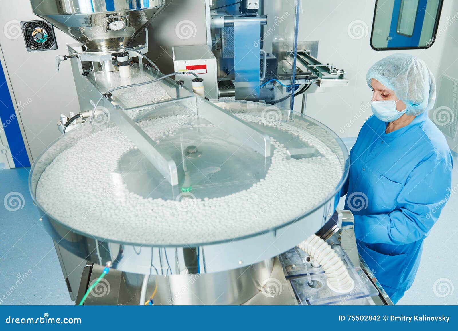 pharmaceutics. pharmaceutical worker operates tablet blister packaging machine