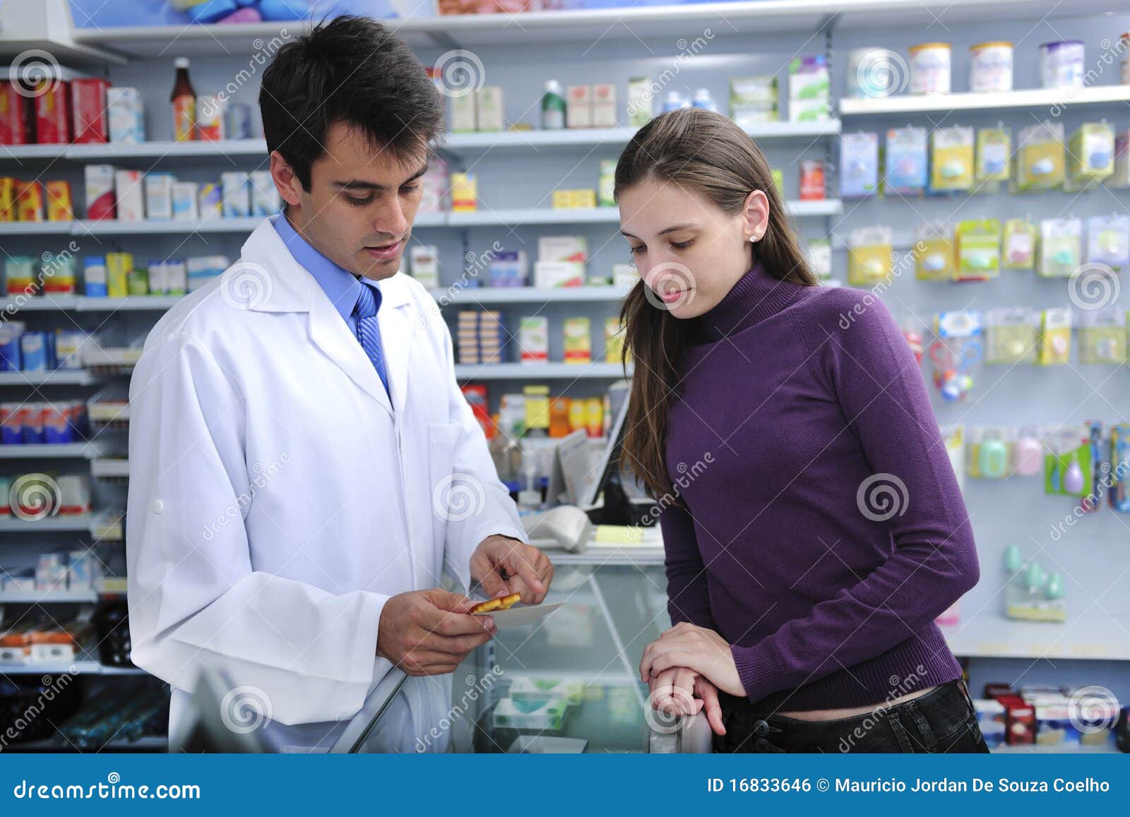 pharmacist advising client at pharmacy