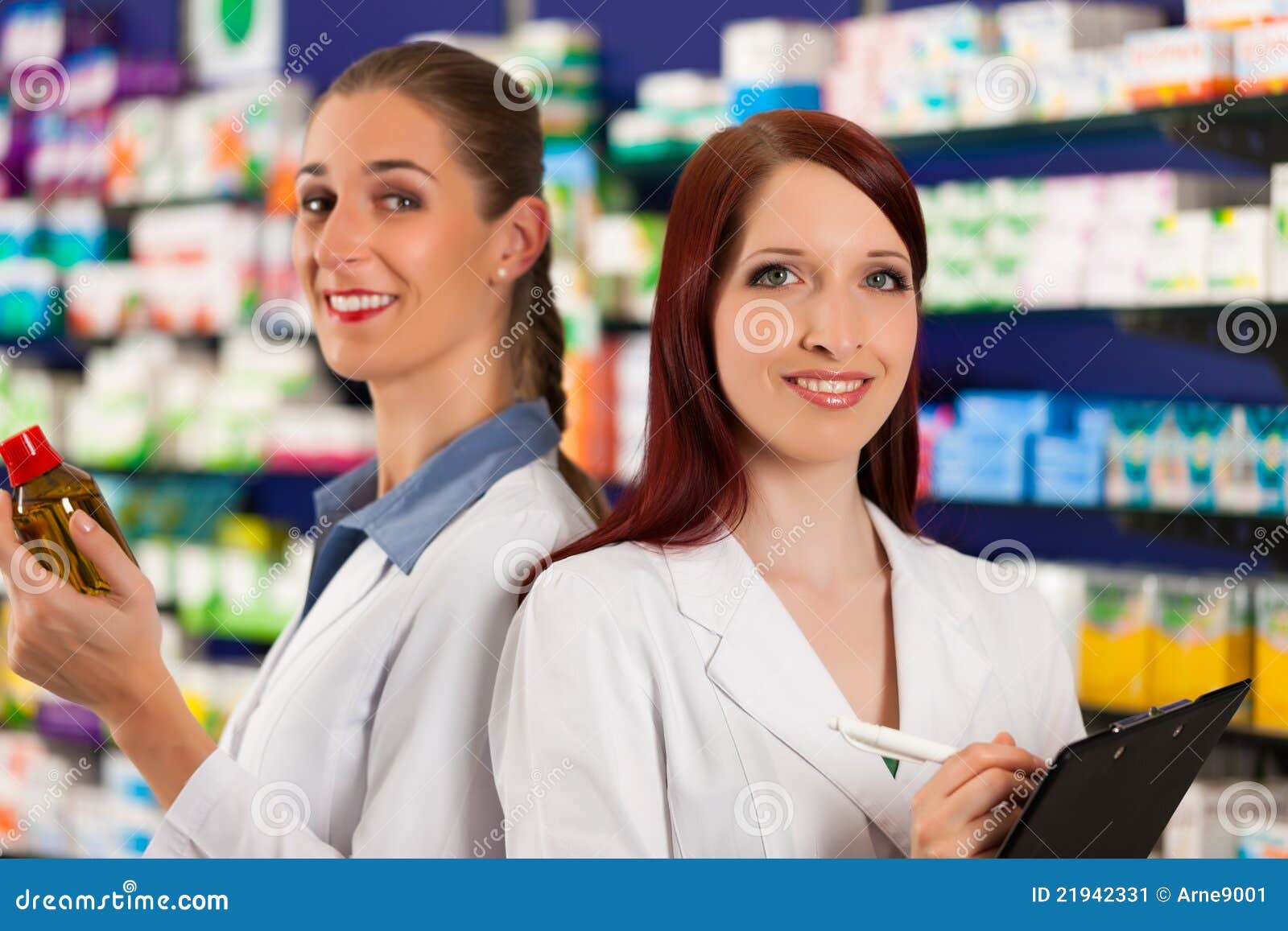 Pharmacist with Assistant in Pharmacy Stock Image Image of employee