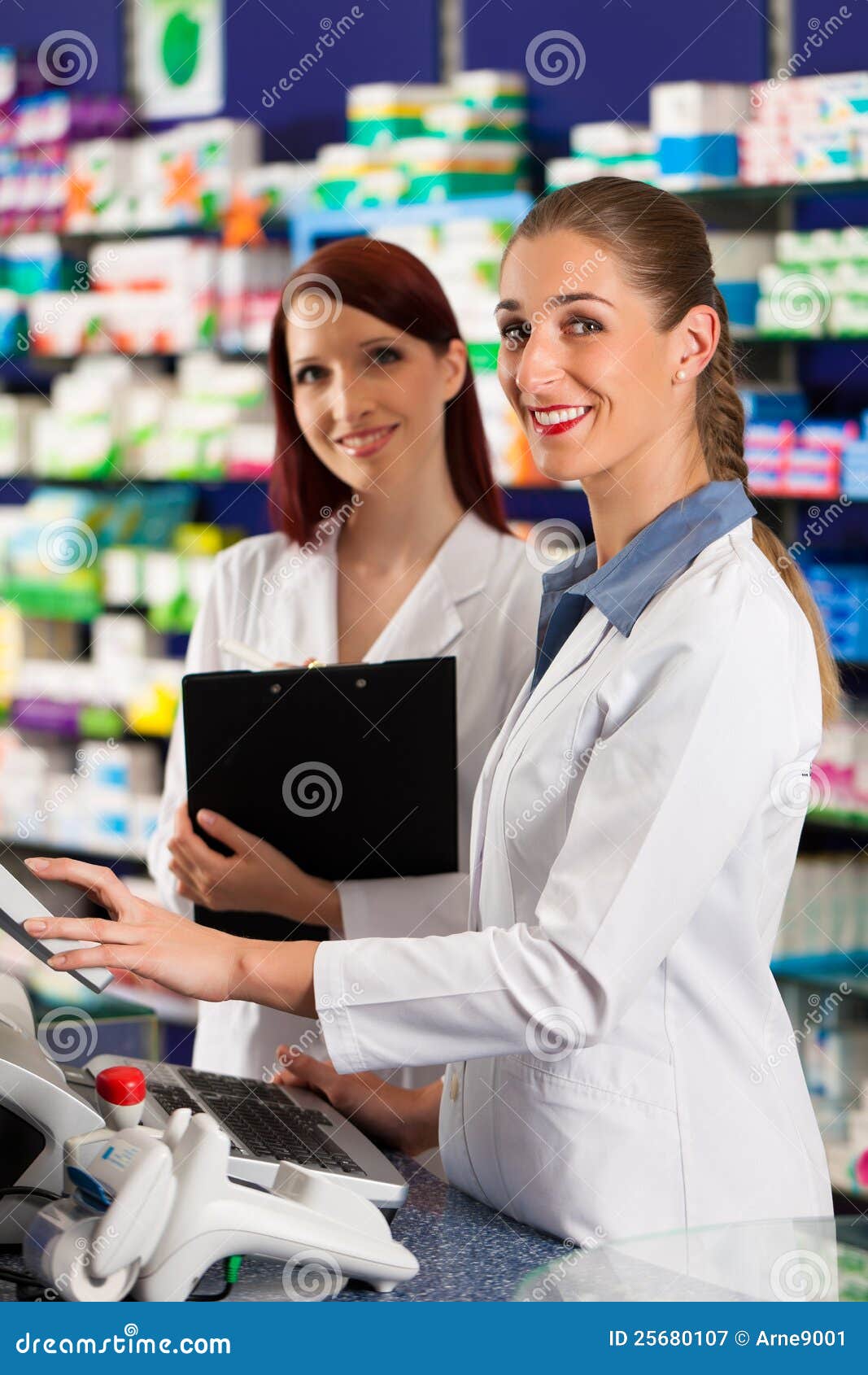 Pharmacist with Assistant in Pharmacy Stock Image Image of drugstore