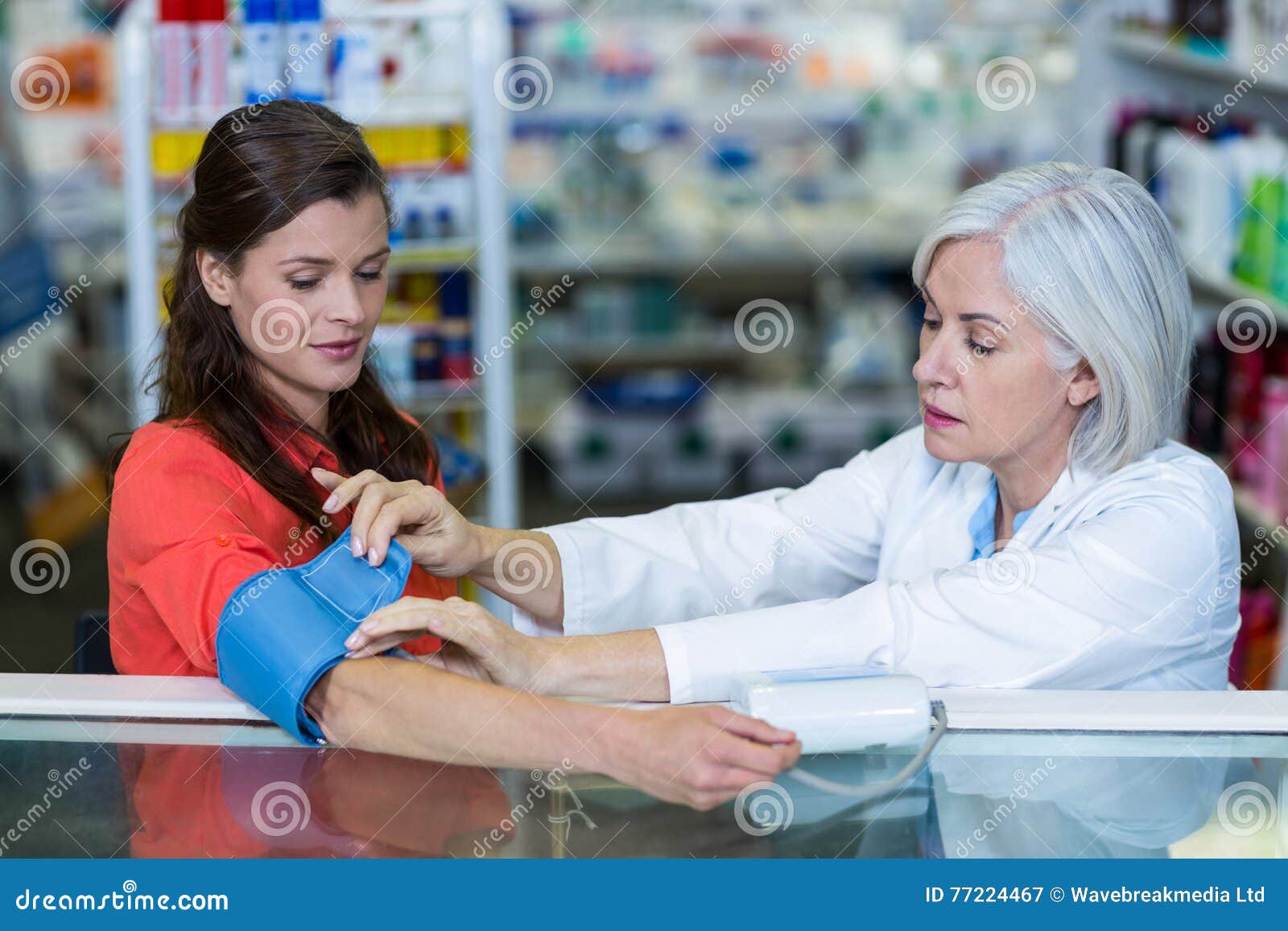 Pharmacist Checking Blood Pressure of Customer Stock Image Image of