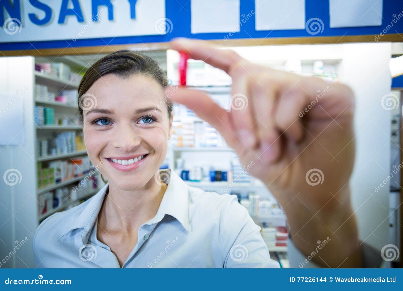 Pharmacist Checking a Capsule Stock Photo Image of clinic, female