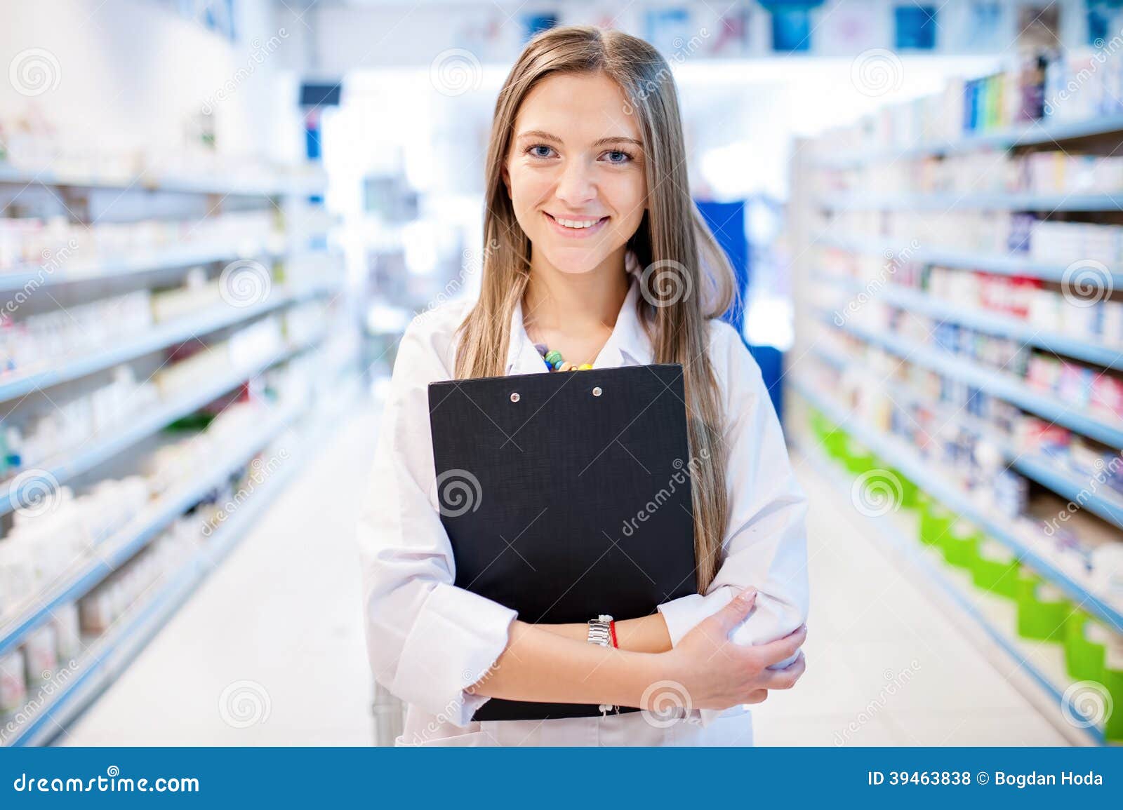 pharmacist with clipboard and prescription drugs