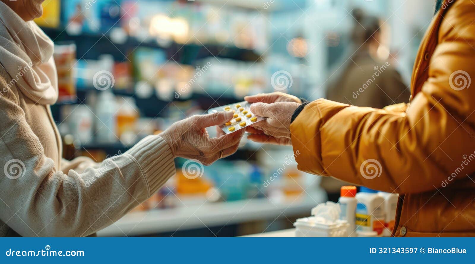 pharmacist handing medication to customer at pharmacy aig51a