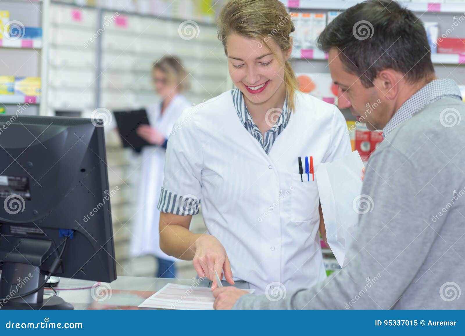 Pharmacist Helping Customer at Counter Place Stock Image - Image of