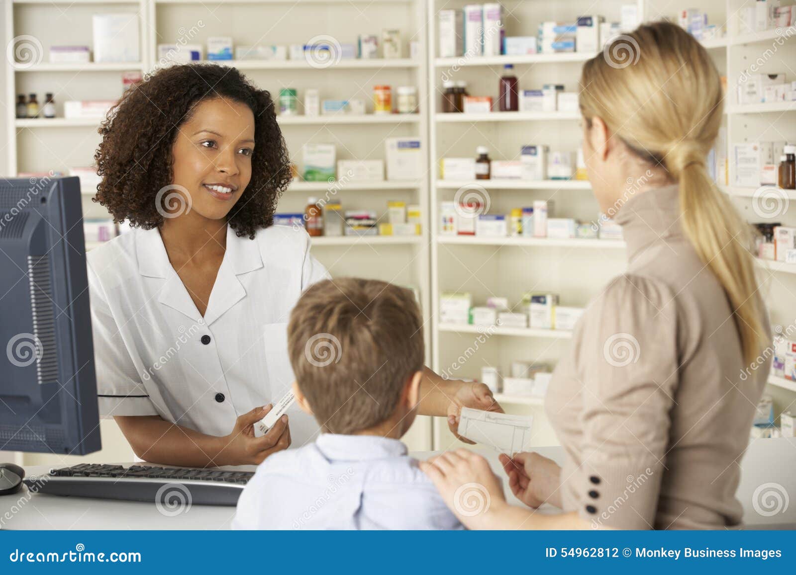 Pharmacist in Pharmacy with Mother and Child Stock Photo Image of