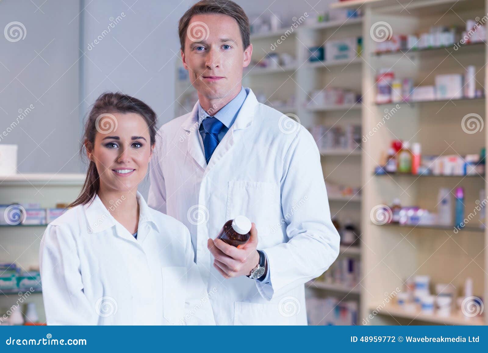 Pharmacist Showing Medication To His Trainee Stock Photo Image of