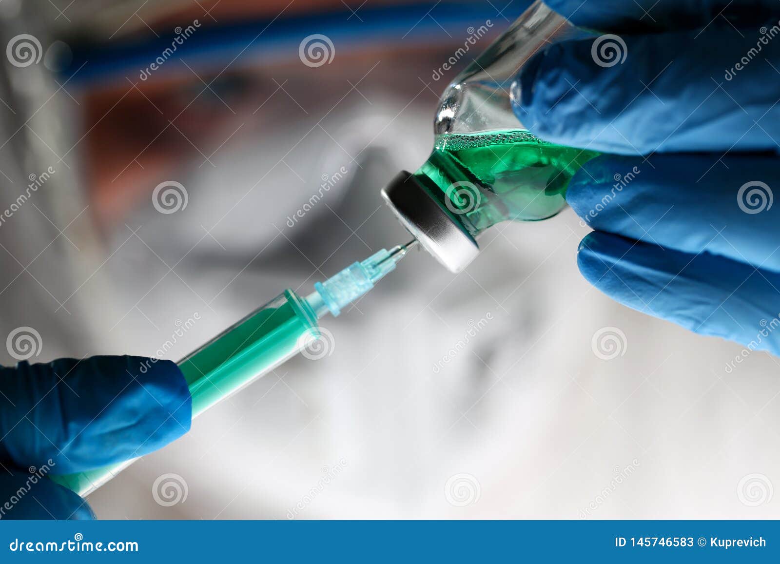 pharmacist syringe dosing green liquid vaccine
