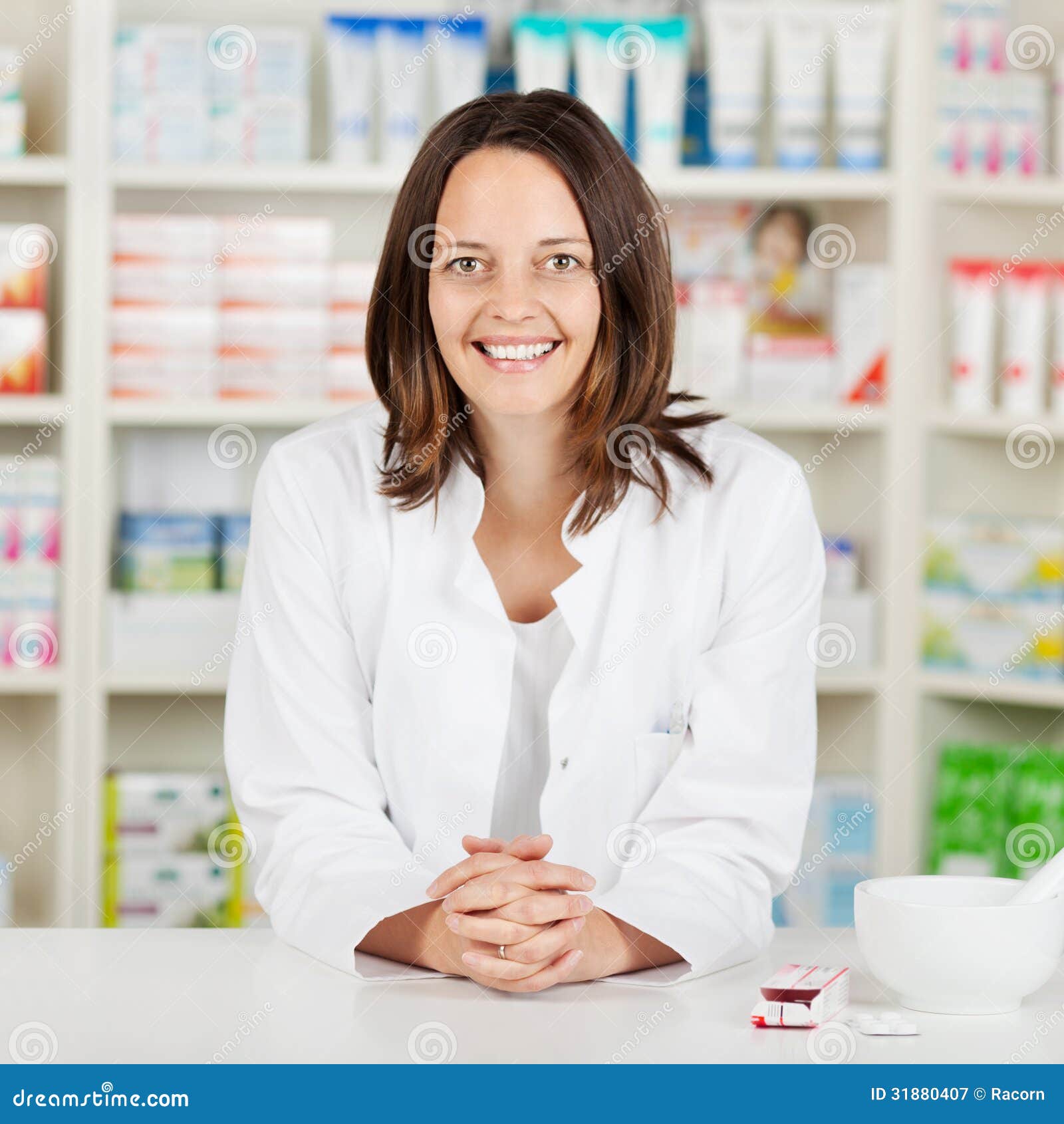 Pharmacist With Tablets At Pharmacy Counter Royalty Free Stock