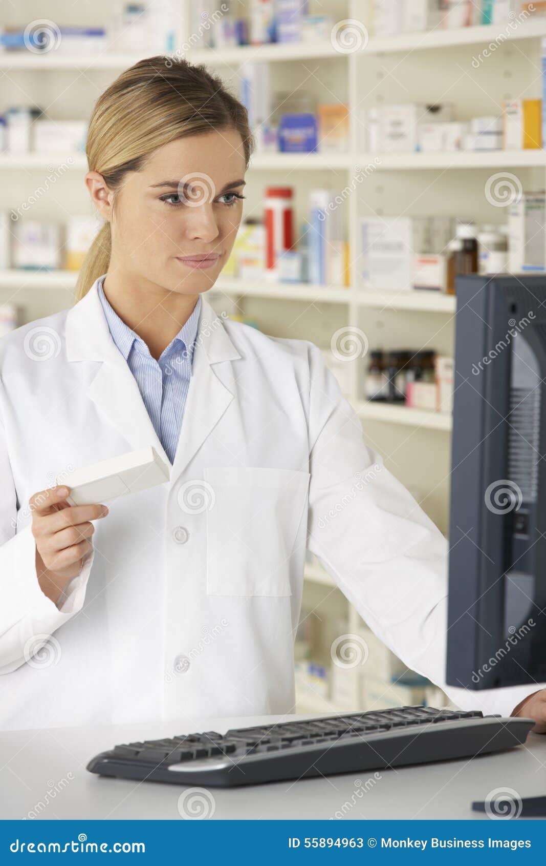 Pharmacist Working on Computer in Pharmacy Stock Image Image of