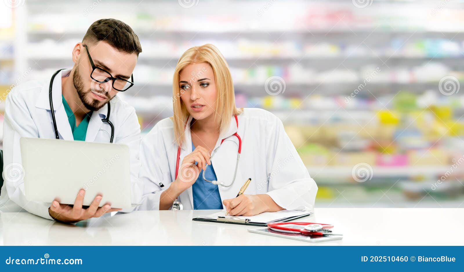 Pharmacist Working with Computer in Pharmacy. Stock Photo Image of