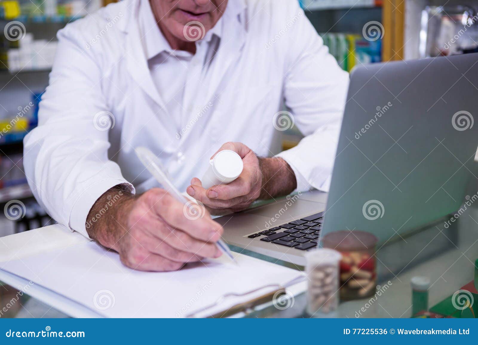 pharmacist writing prescriptions for medicines