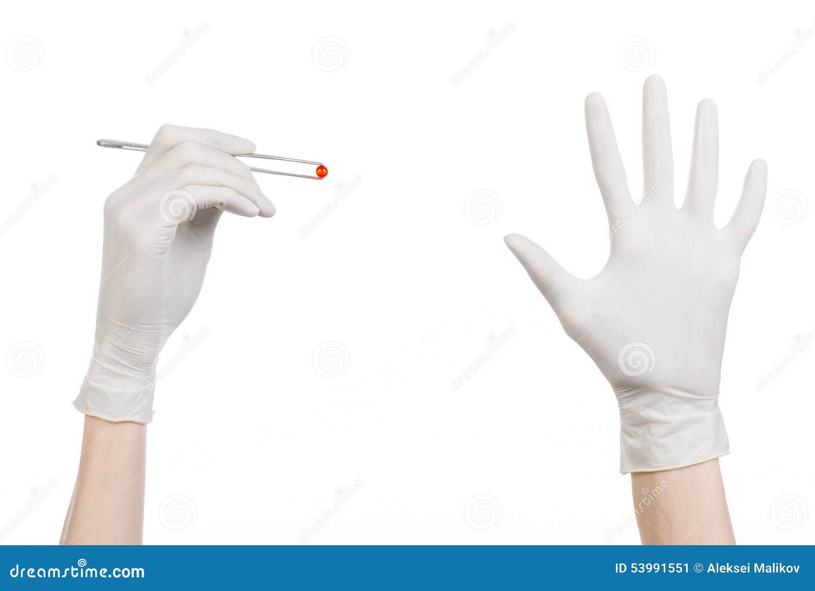 pharmacology and medical theme: doctor's hand in a white glove holding tweezers with red pill capsule  on white background