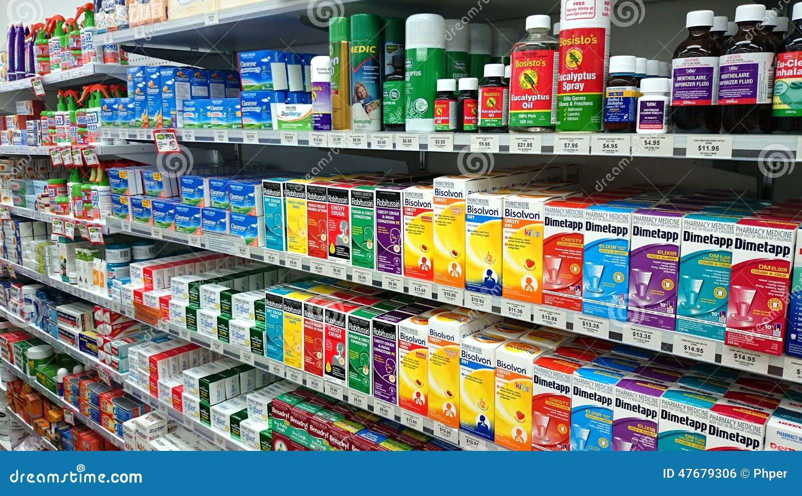 Shelves of pharmaceutical products are displayed in a pharmacy drug 