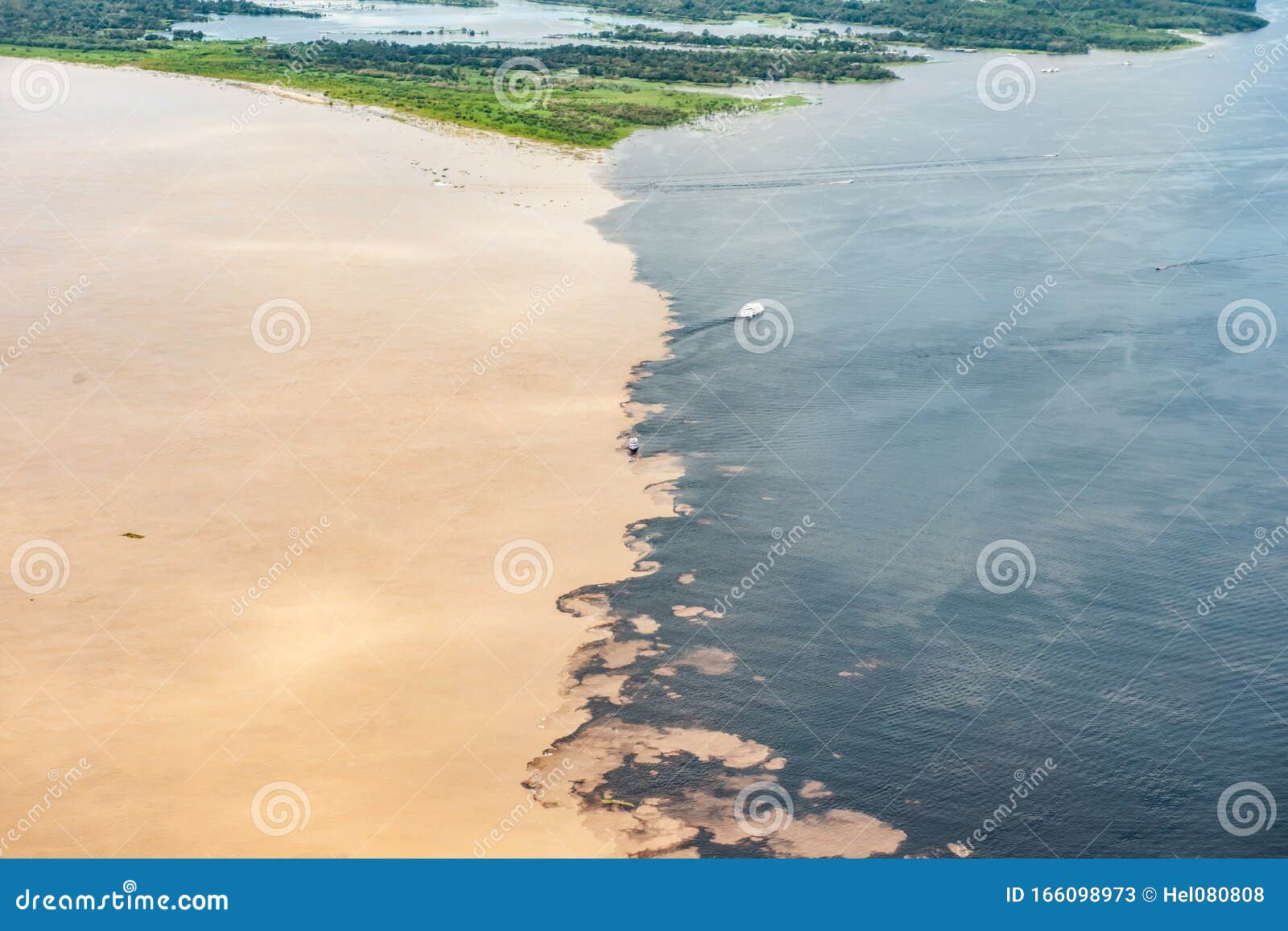 phenomenon of amazon - meeting of the waters - aerial view with two steamboats