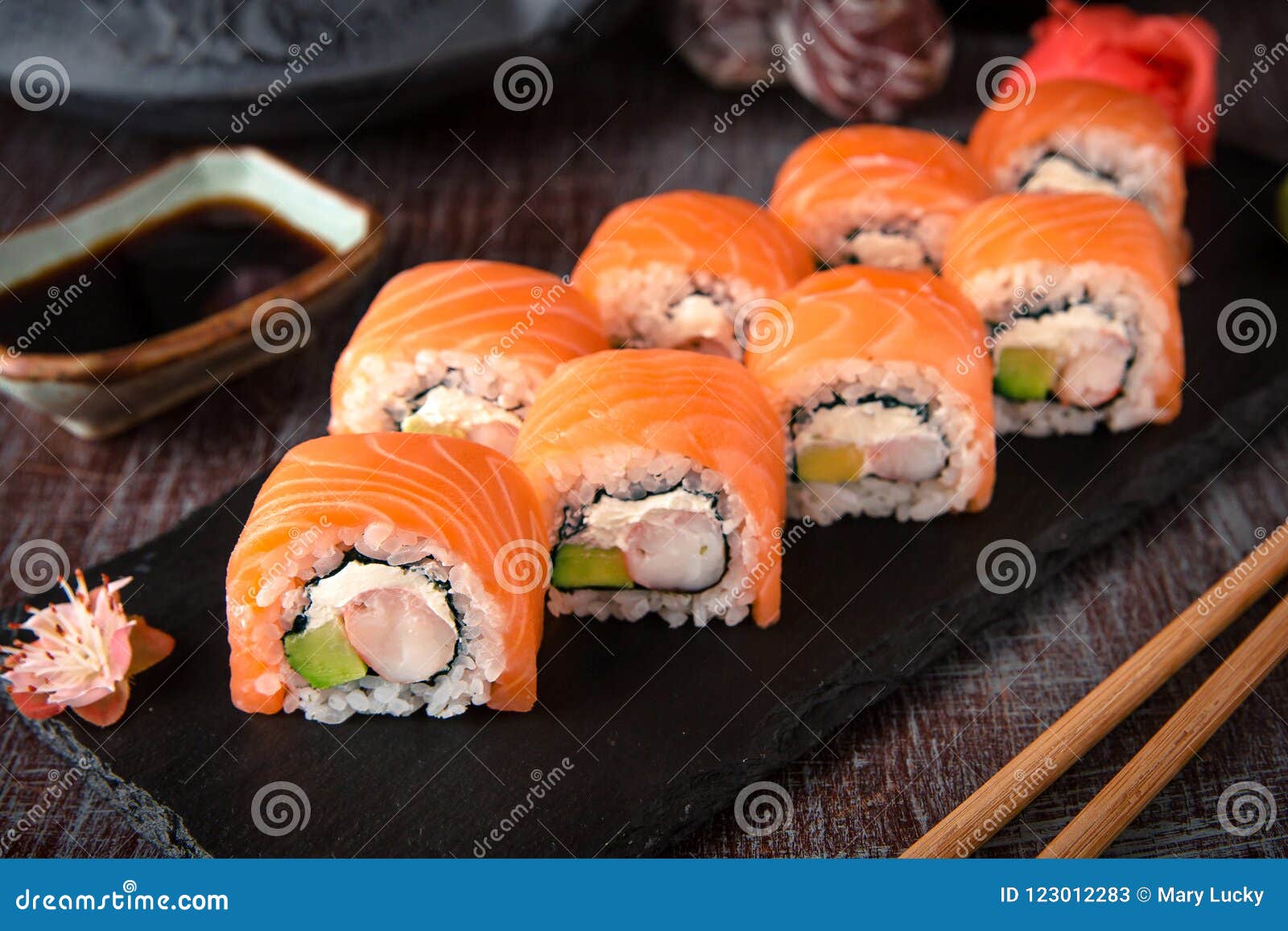 philadelphia roll sushi with salmon, prawn, avocado, cream cheese. sushi menu.