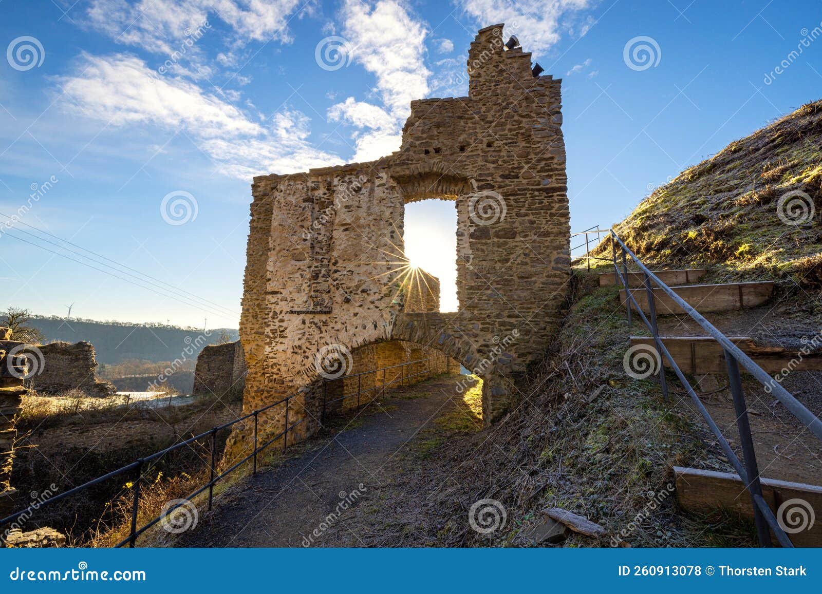 philippsburg castle ruins with castle tower near monreal in sunshine and a blue sky