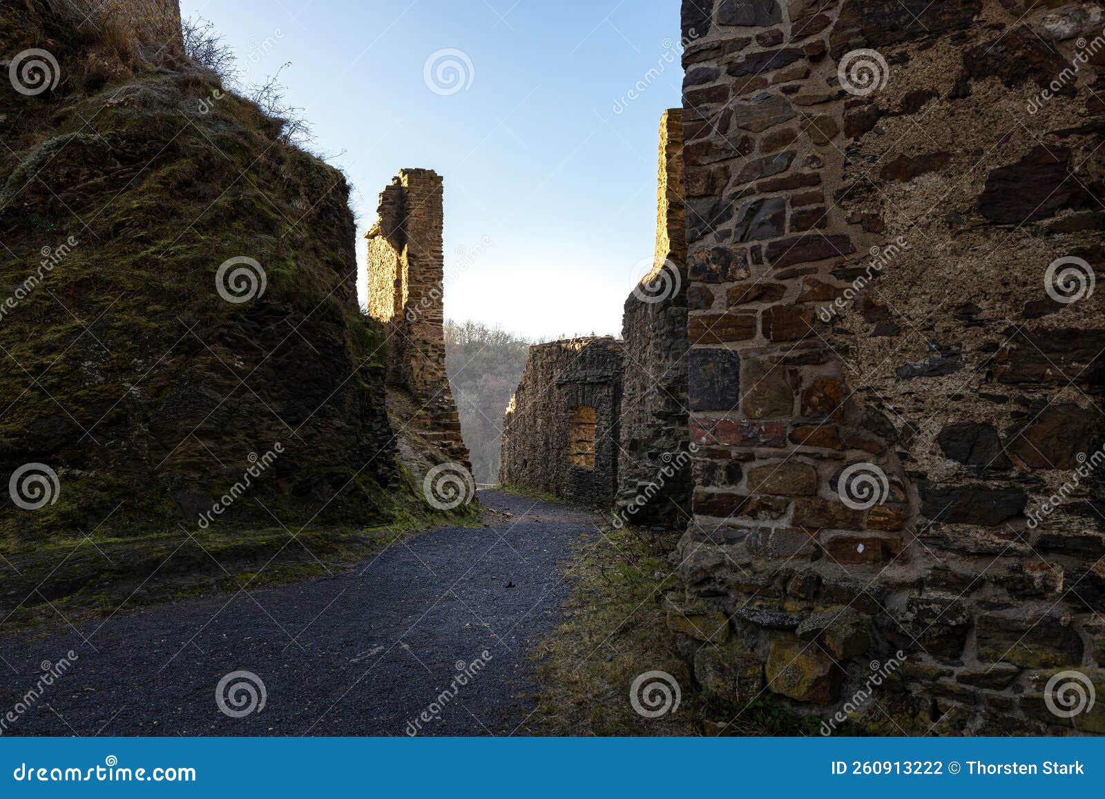 philippsburg castle ruins with castle tower near monreal in sunshine and a blue sky