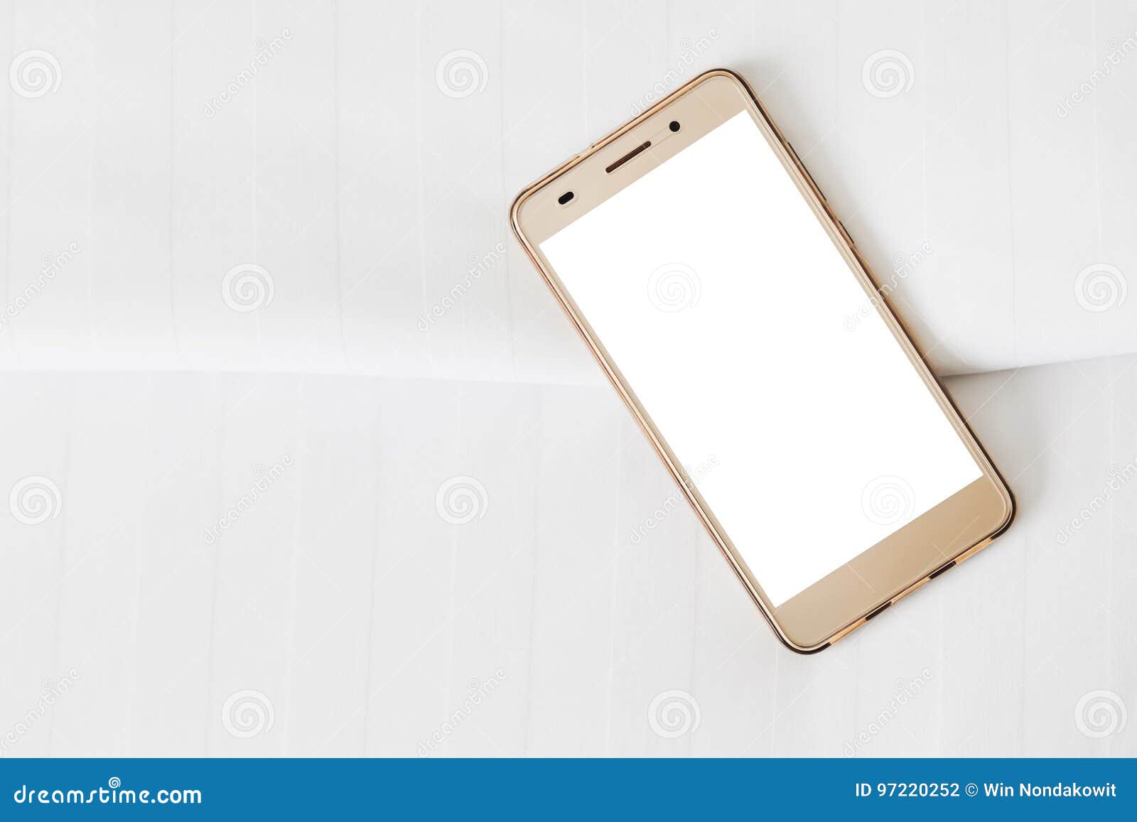 Phone on bed sheets stock photo. Image of smartphone 97220252