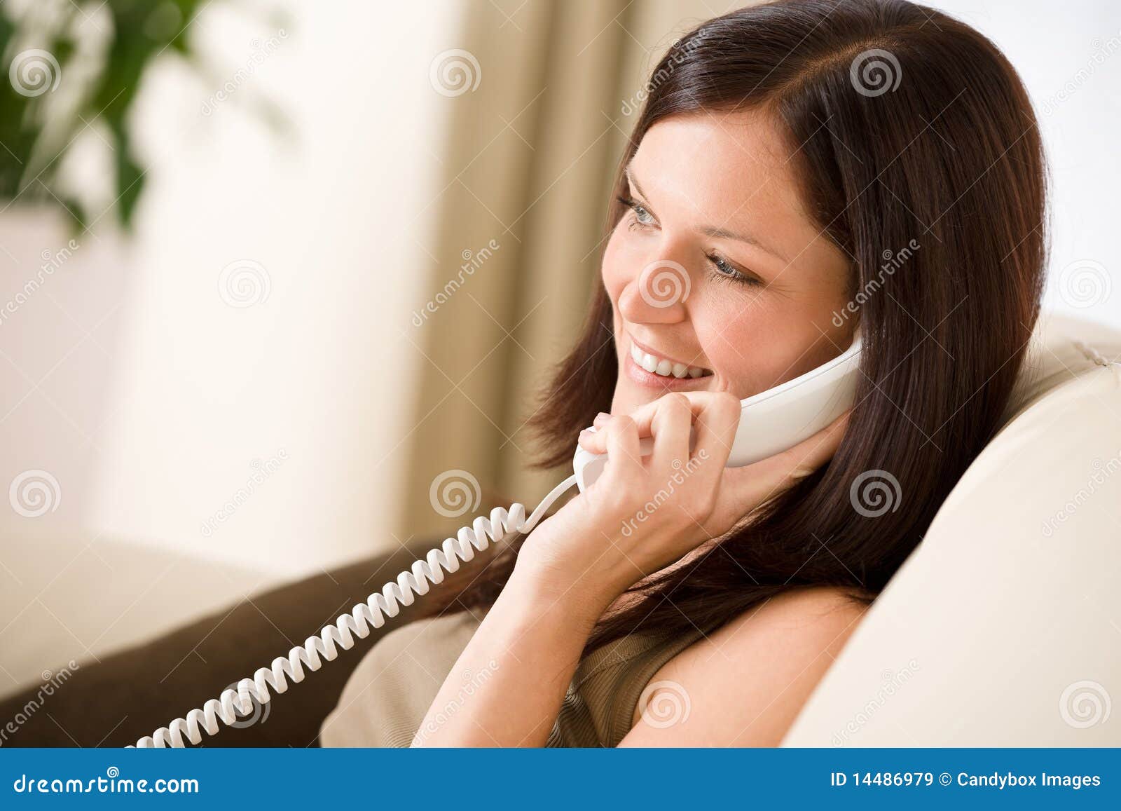 On the Phone Home: Woman Calling Stock Image - Image of woman, sofa