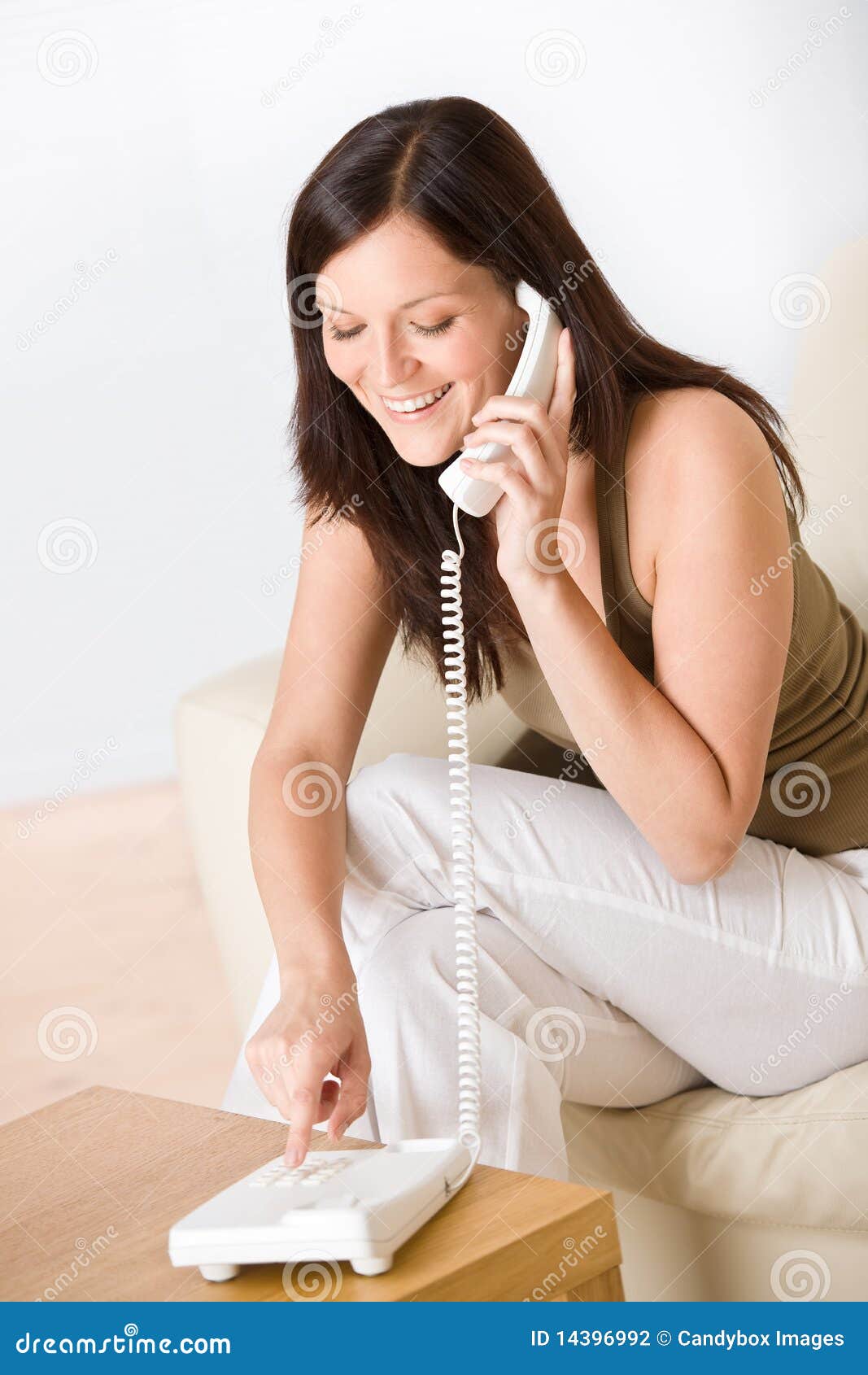 On the Phone Home: Woman Dialing Number Calling Stock Photo - Image of