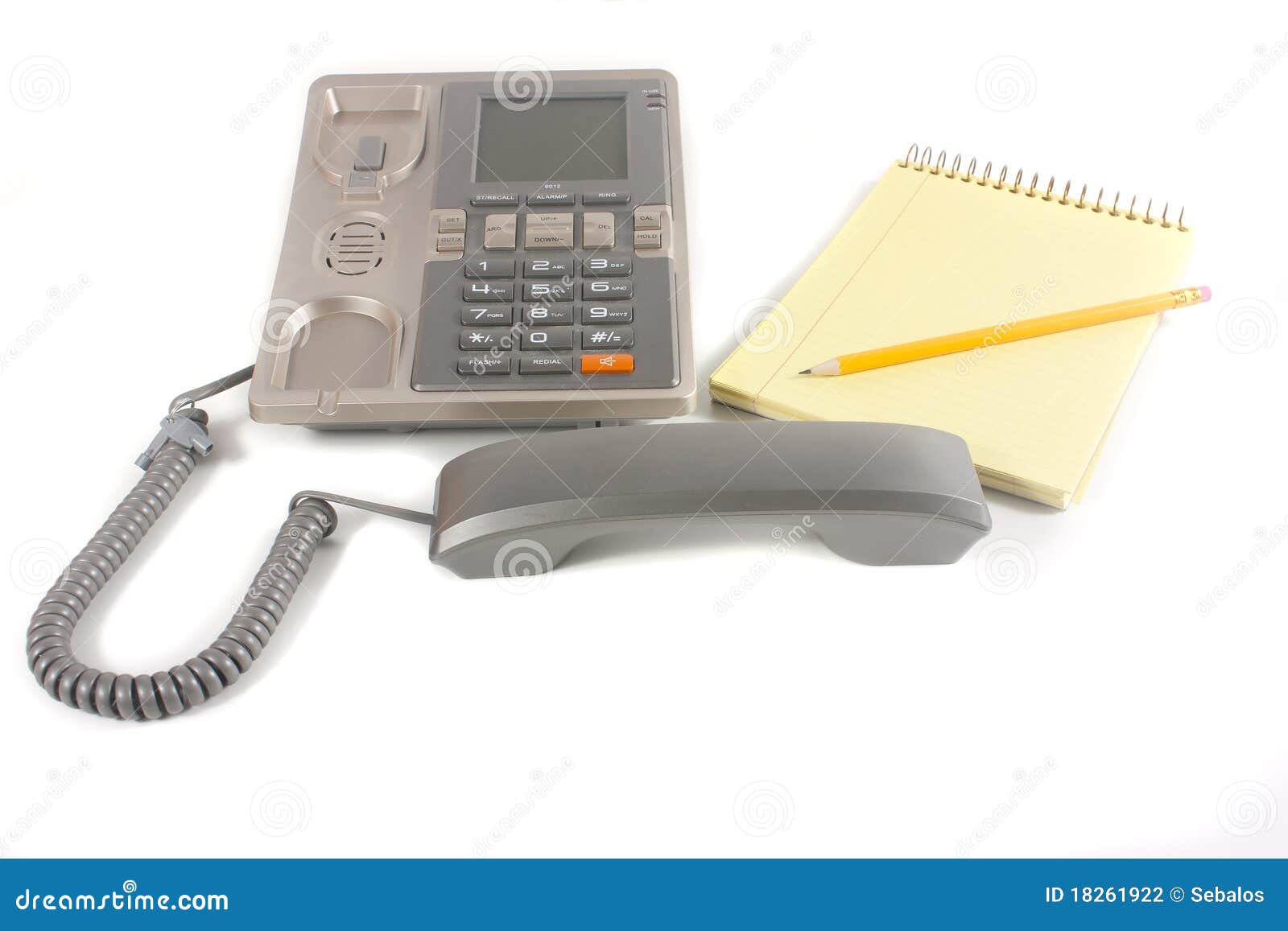 Phone and notebook. Phone and one spiral notebook with one pencil isolated over white background