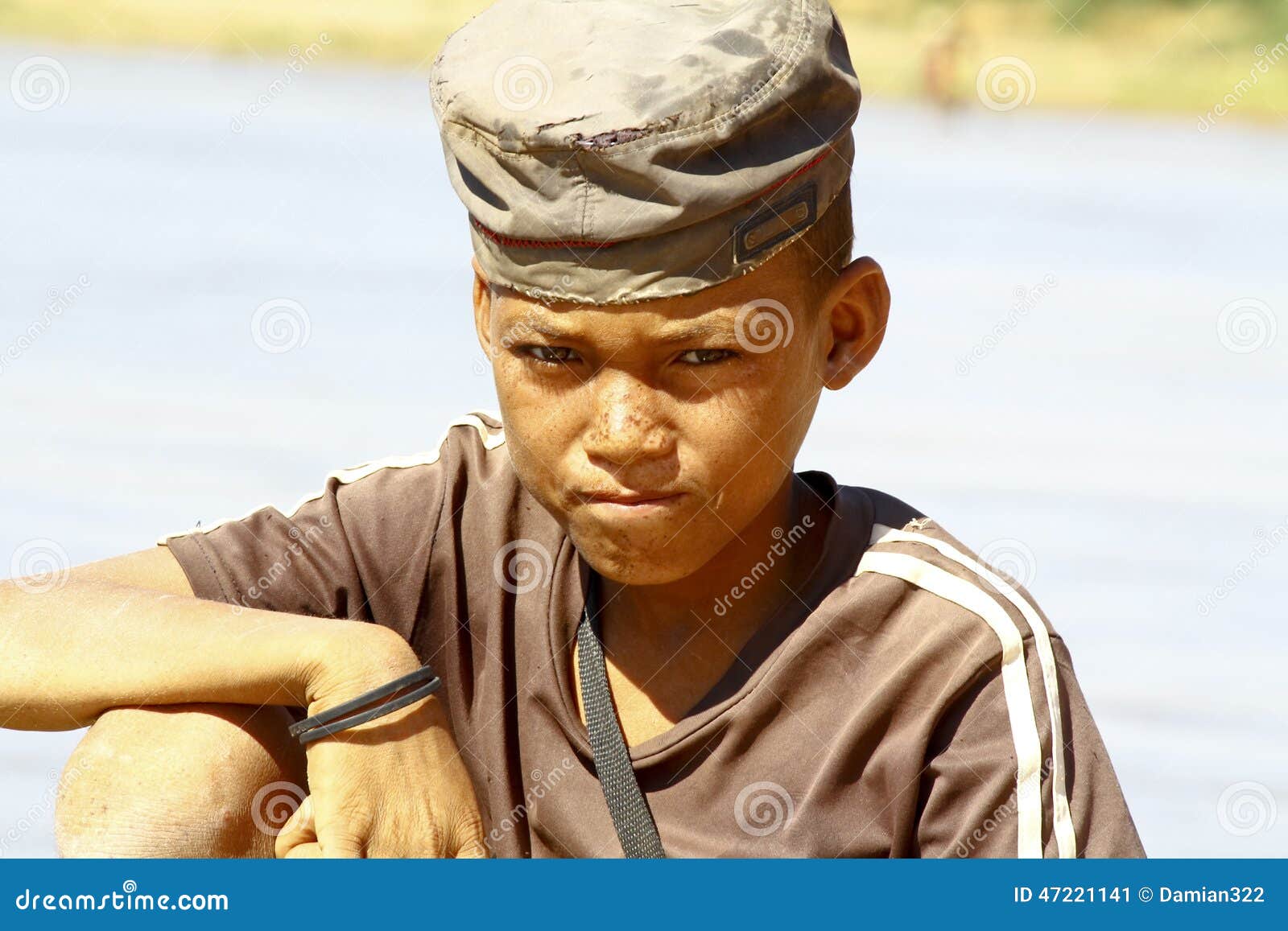 Photo of Adorable Young Happy Boy - African Poor Child on the Ri Stock ...