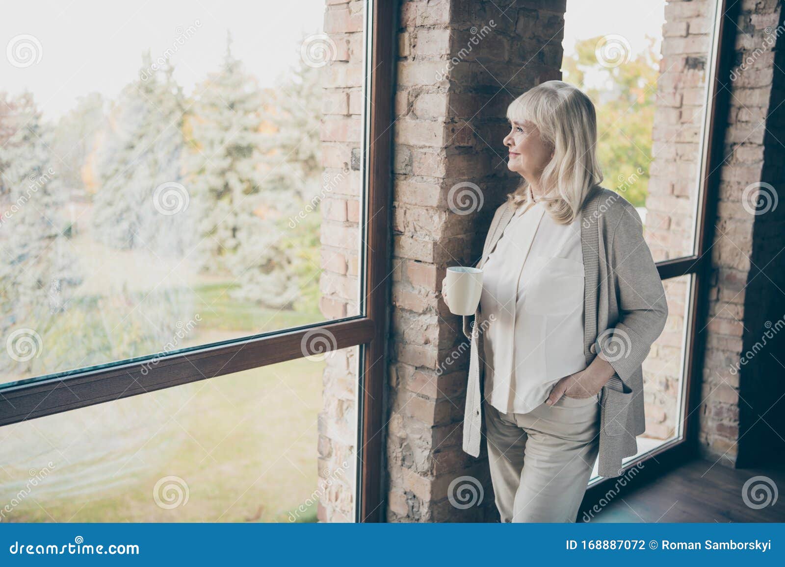 Photo Of Amazing Blond Adorable Aged Granny Homey Good Mood Drinking