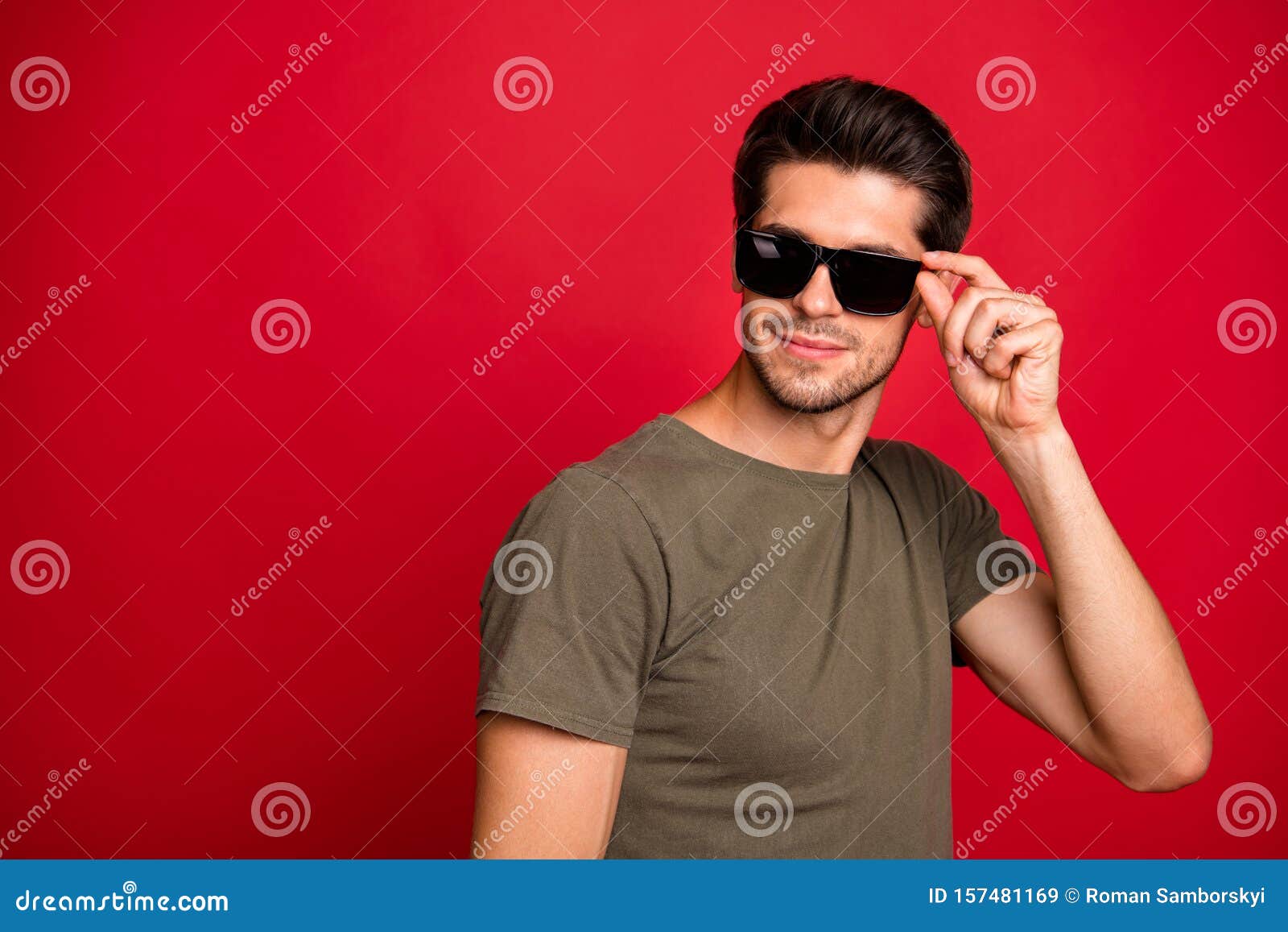 Photo of Amazing Guy Holding Sun Specs Hands Wear Grey T-shirt Isolated ...