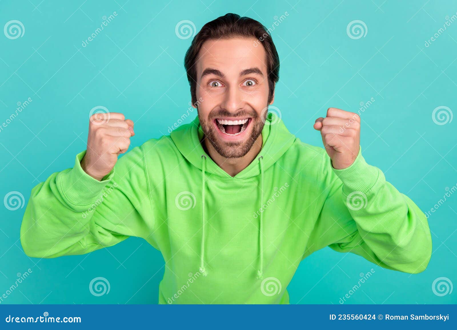 Photo of Astonished Guy Celebrate Successful Bet Goal Attainment