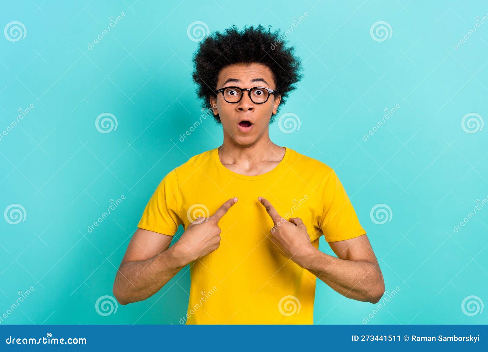 Photo Of Astonished Speechless Guy Afro Hairstyle Wear Yellow T Shirt Directing At Himself