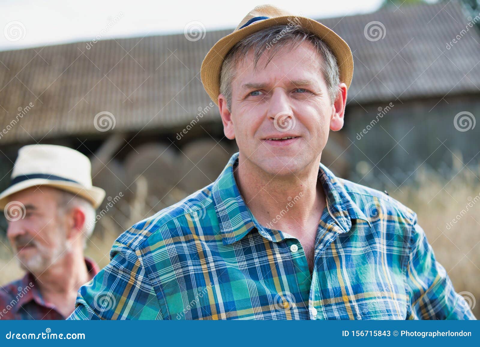 Attractive Mature Farmer Standing Against Senior Farmer At Barn Stock Image Image Of Mature