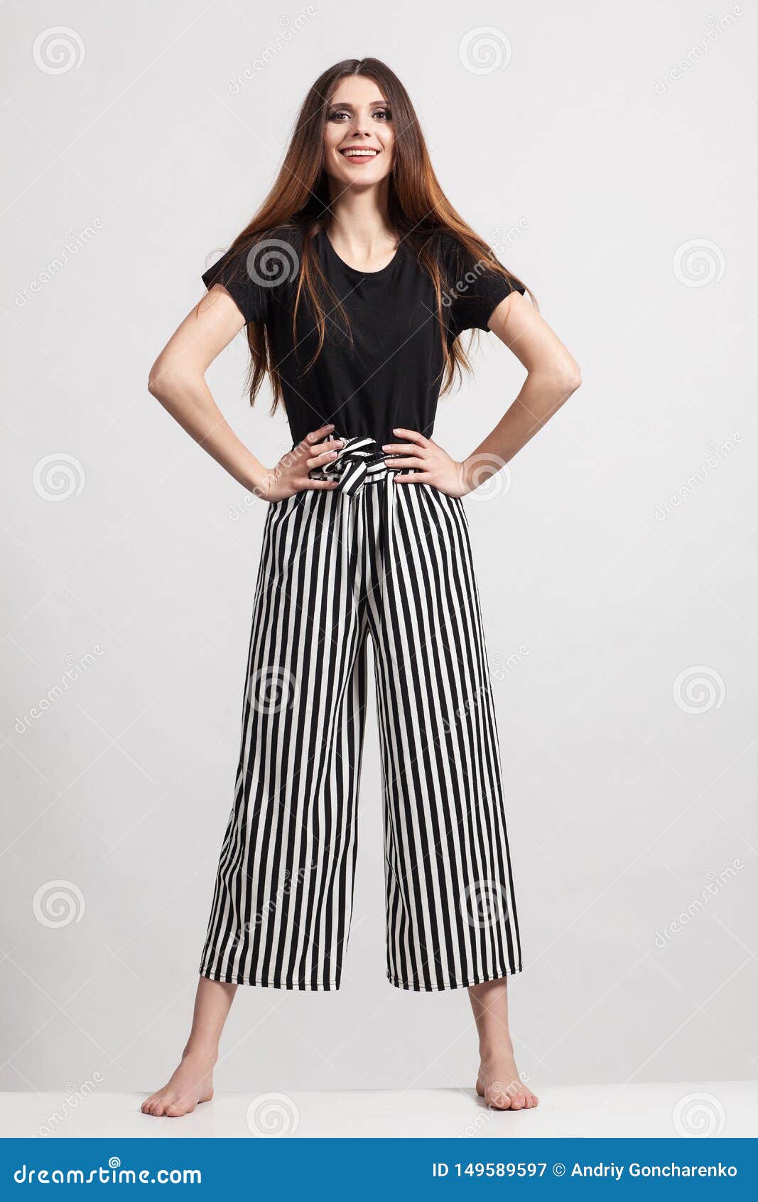 Photo Of A Beautiful Slim Woman In Full Growth Dressed In A Black