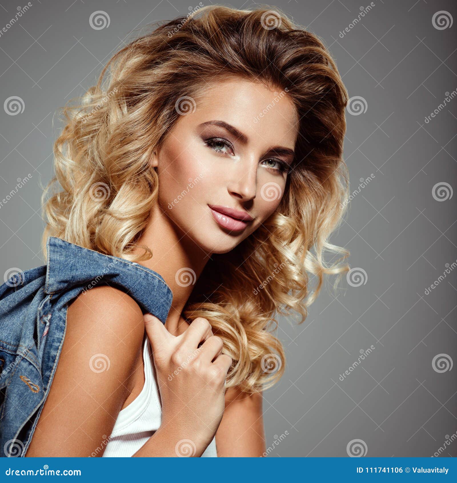 Photo of a Beautiful Young Blond Girl with Curly Hair Stock Photo ...