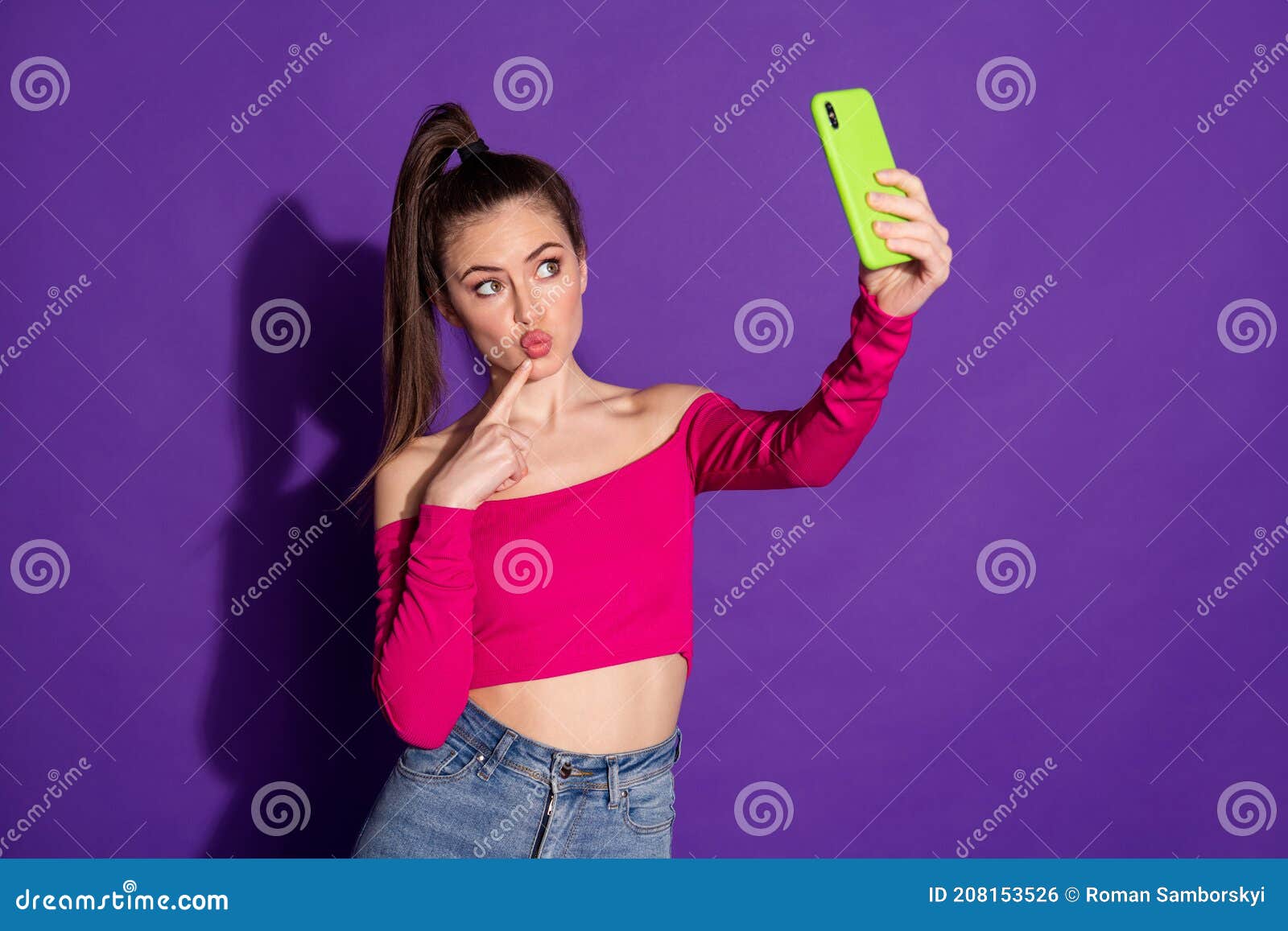 Photo Of Blogger Girl Hold Cellphone Make Selfie Finger Face Wear Pink Top Isolated Purple Color