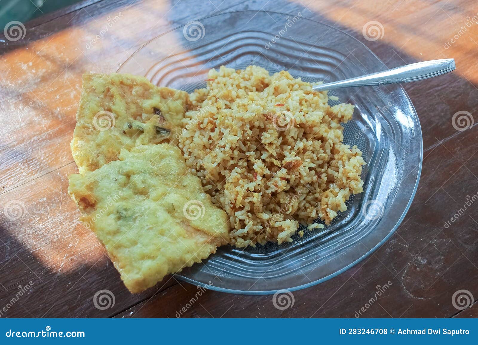 Photo of a Breakfast Dish that is on the Table with a Menu of Egg Fried