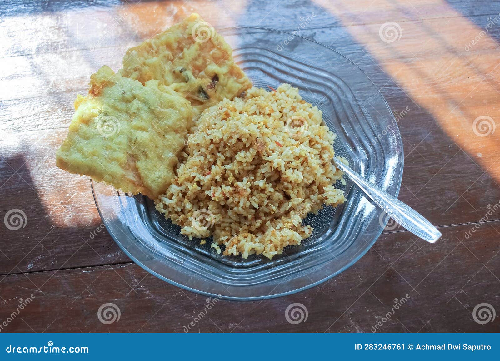 Photo of a Breakfast Dish that is on the Table with a Menu of Egg Fried