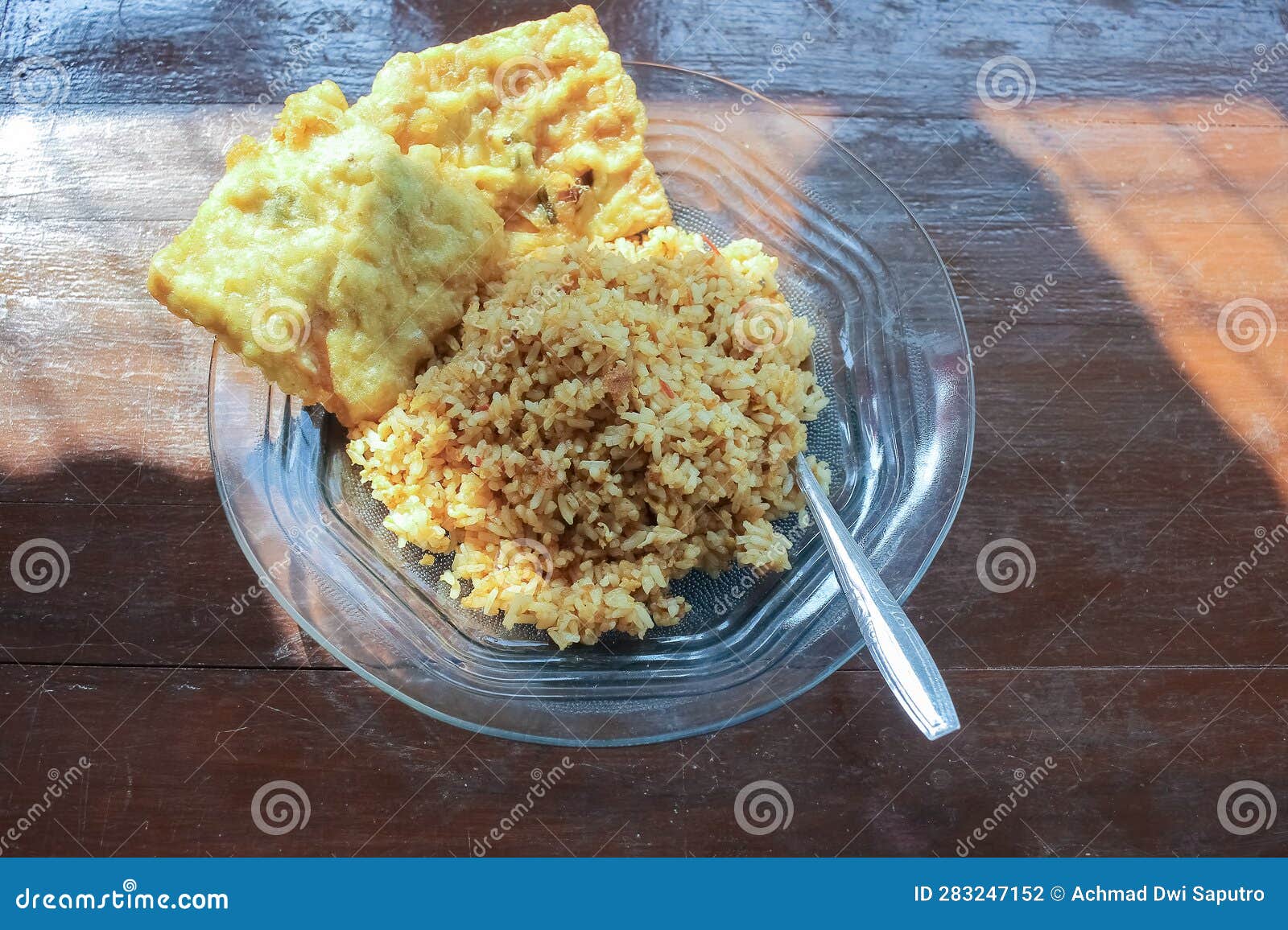 Photo of a Breakfast Dish that is on the Table with a Menu of Egg Fried