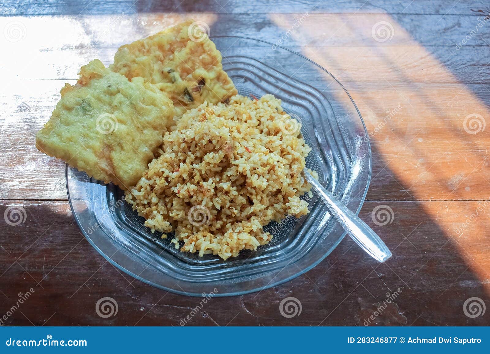 Photo of a Breakfast Dish that is on the Table with a Menu of Egg Fried