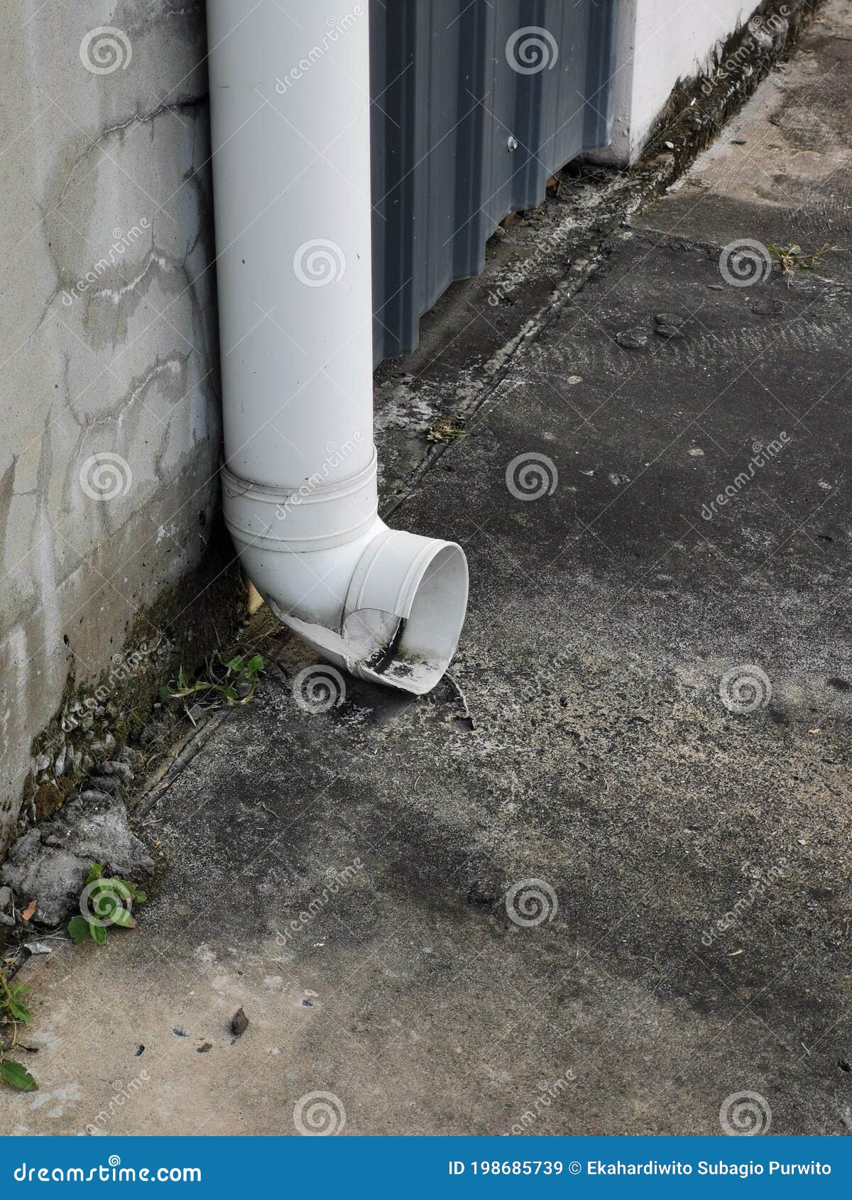 photo of broken white 6 inch pvc pipe for water drainage.