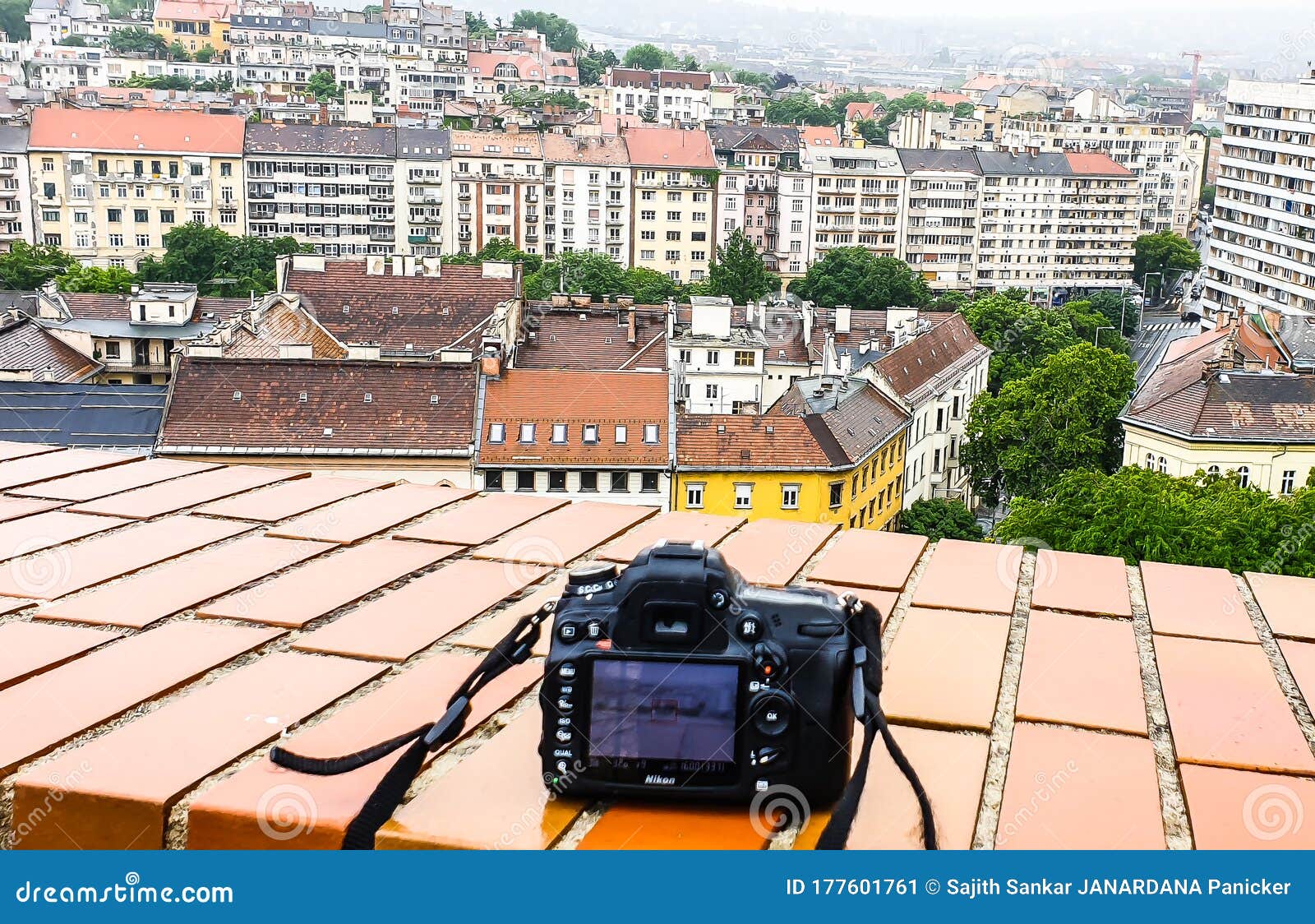 photo of budapest city view and a nikon d7000 camera from top of buda castle