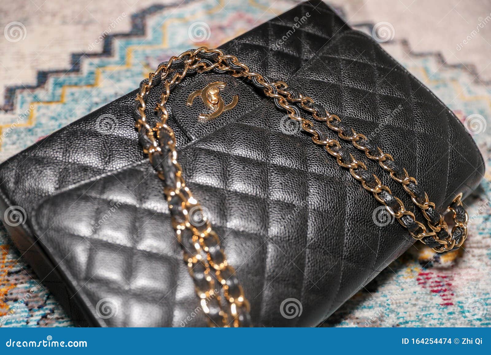 Photo of CHANEL CLASSIC MAXI DOUBLE FLAP Black Handbag Editorial Stock  Image - Image of fashionable, design: 164254474