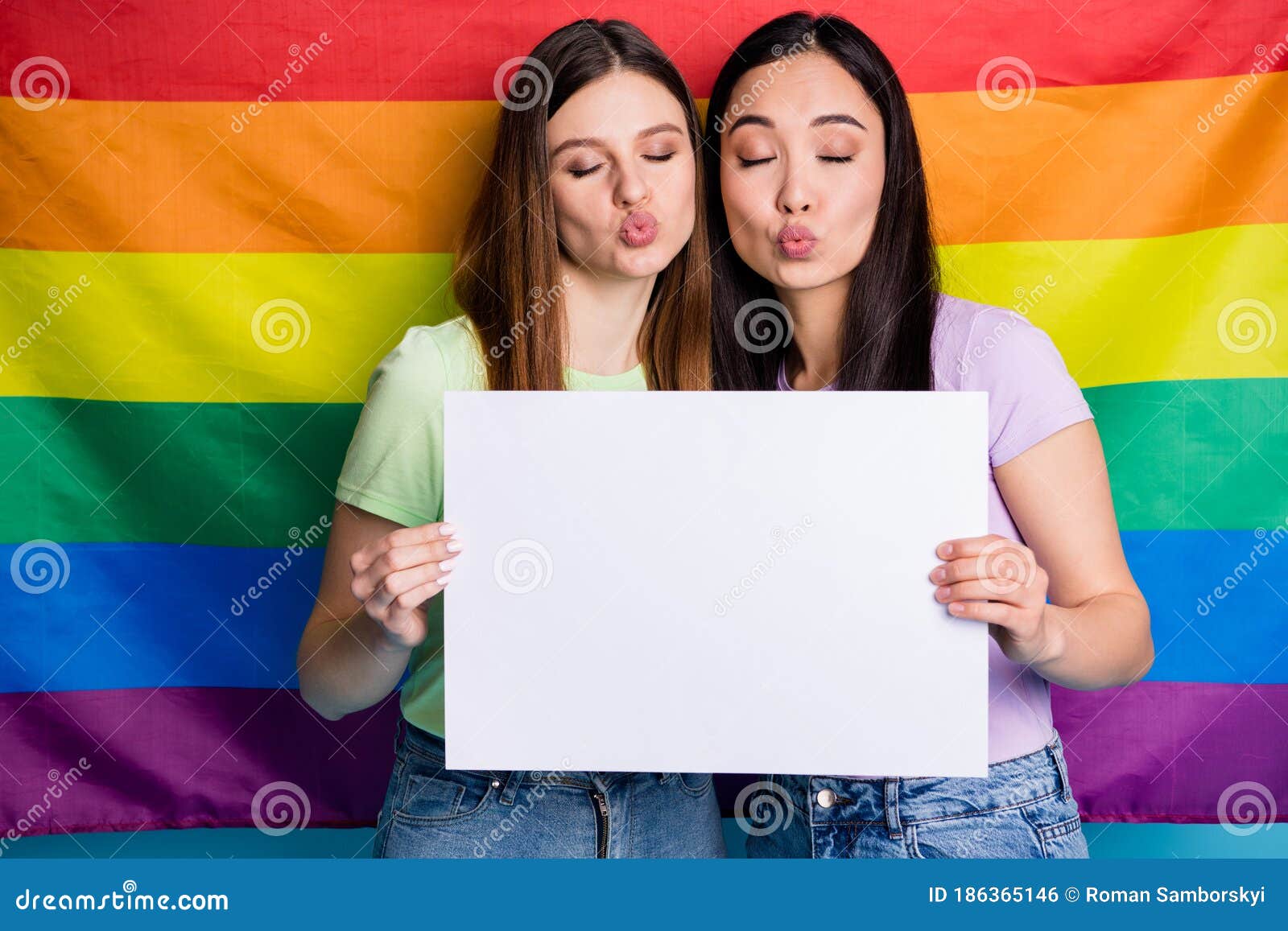 Photo of Charming Flirty Lesbians Couple Ladies Protest Parade Day Tolerance Same Sex Marriage Send Air Kiss Gay Rainbow Stock Photo image
