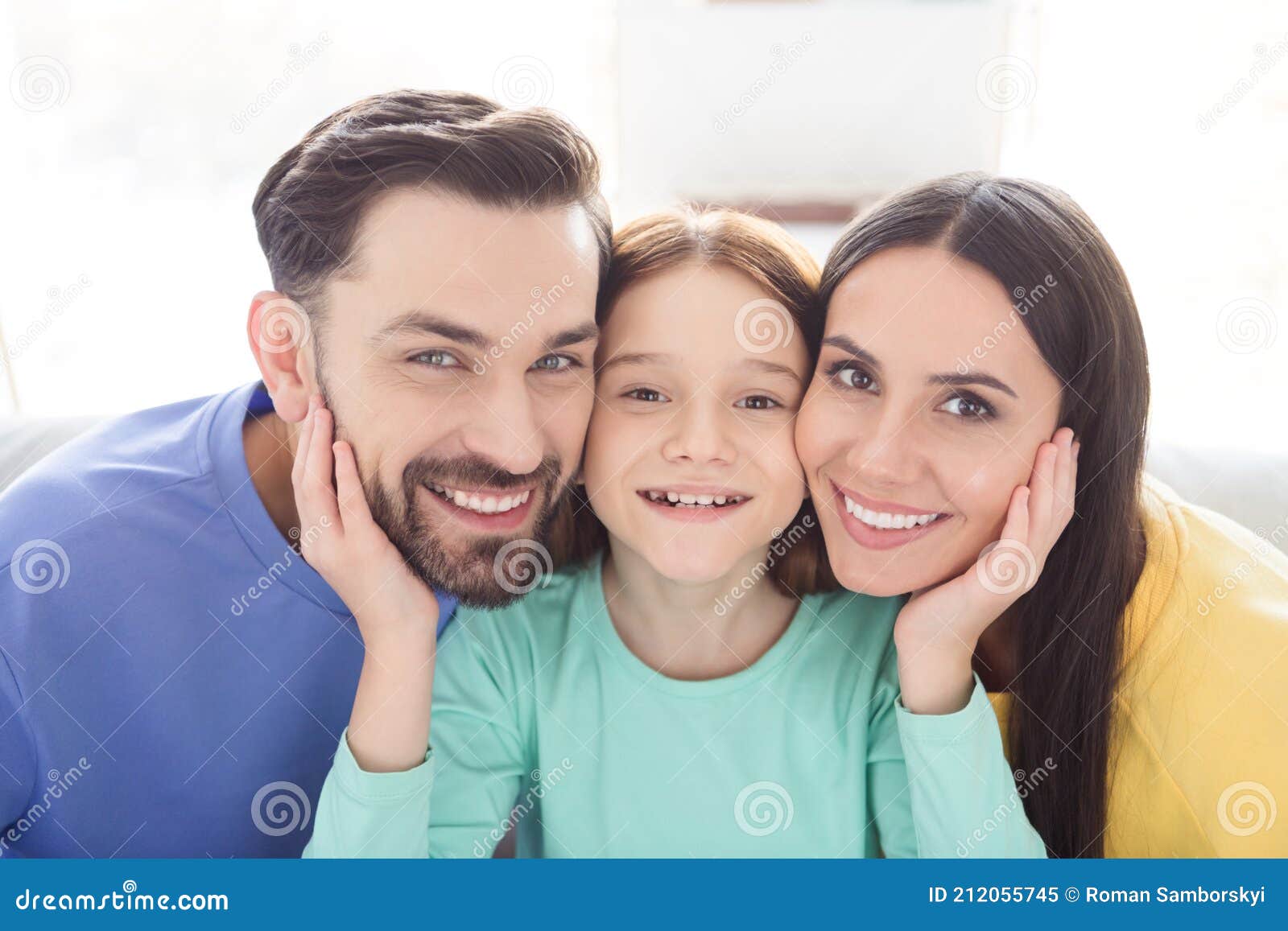 photo of cheerful attractive family mom dad kid happy positive toothy smile enjoy time together indoors