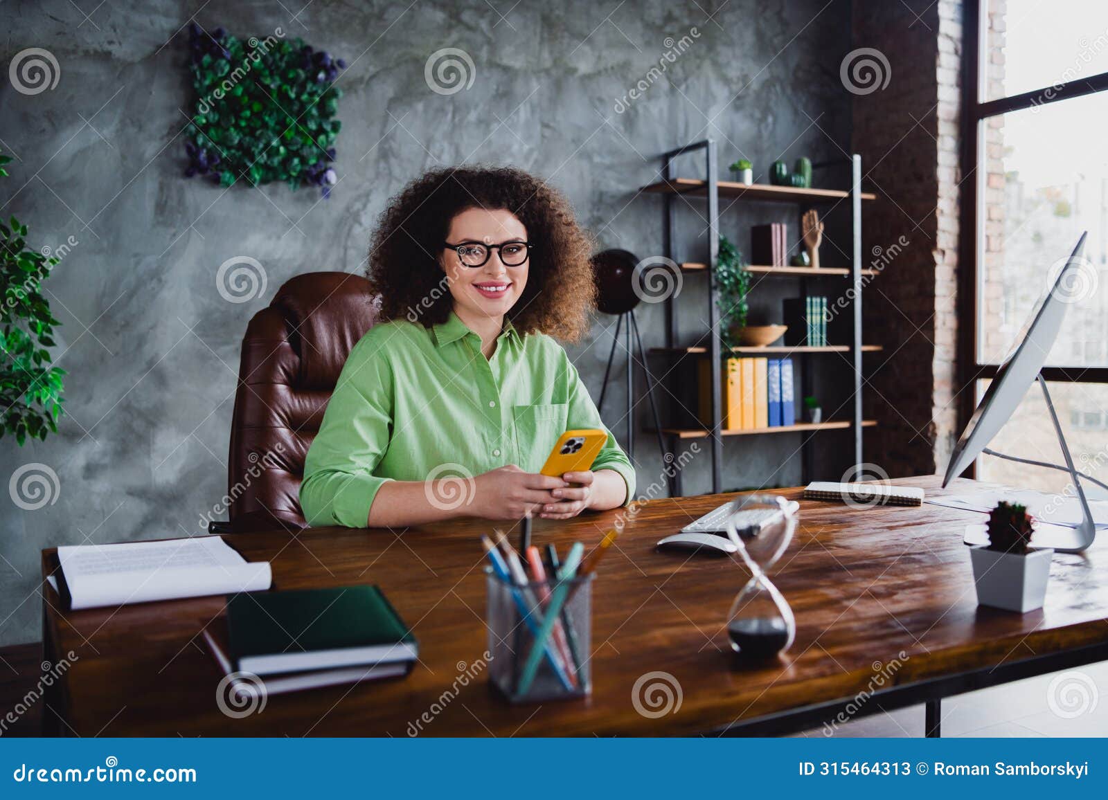 photo of cheerful charming successful lady sitting in modern confort office day light workspace workstation