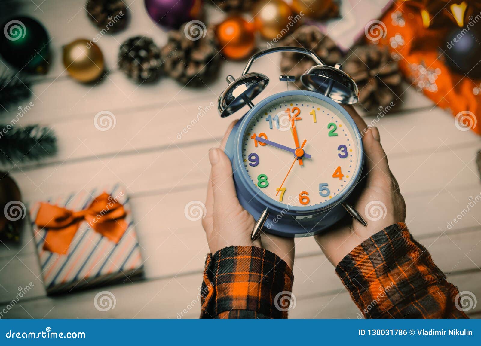 Child Hands Holding a Clock Stock Photo - Image of gifts, blue: 130031786