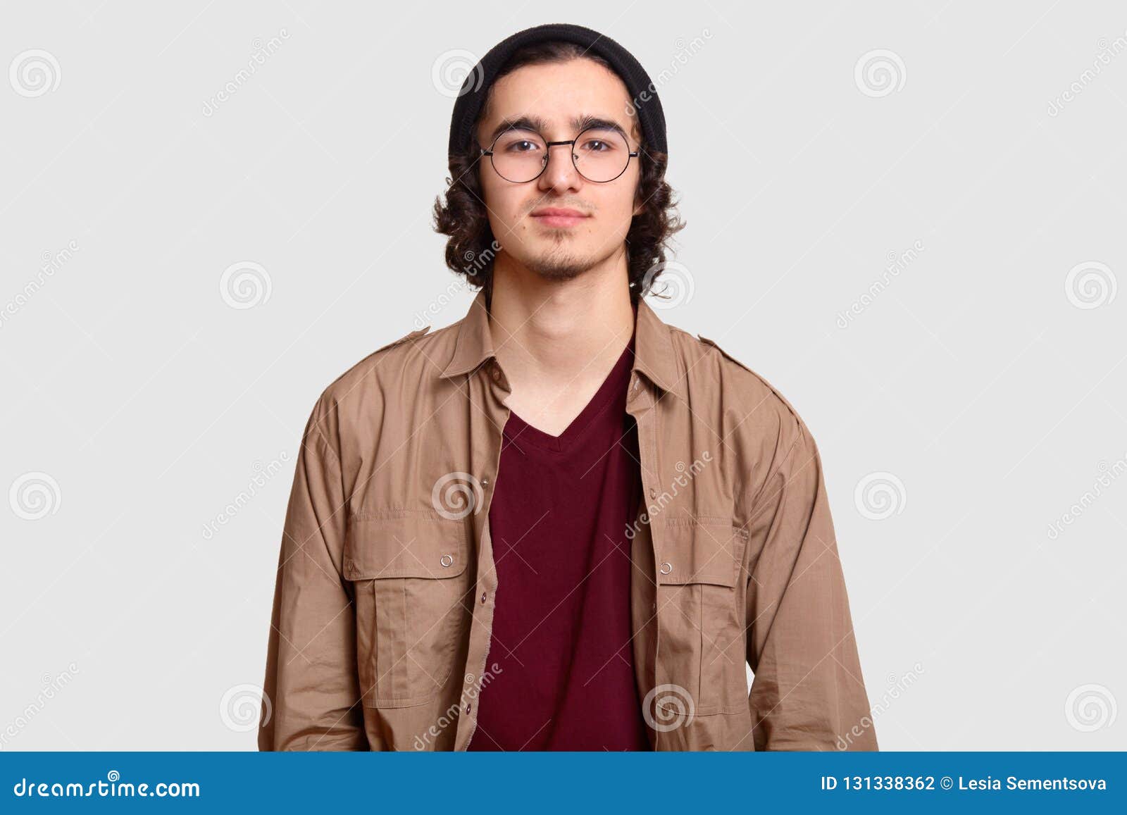 Photo of Curly Male Teenager Wears Round Optical Spectacles, Black Hat ...