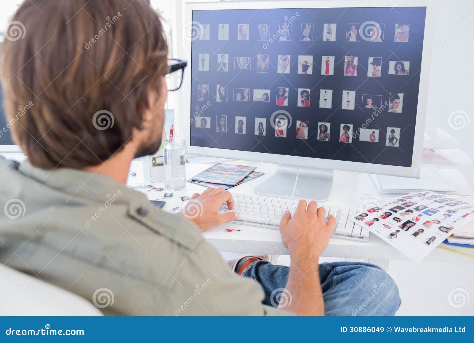 Photo Editor  Viewing Thumbnails On Computer  Stock Image 
